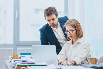 Manager monitoring work of employee