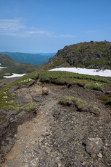Rocky hiking trail over the mountain ranges of Daisetsuzan National Park, Hokkaido, Japan