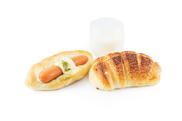bread and glass of milk isolated on white background, selective focus (detailed close-up shot)