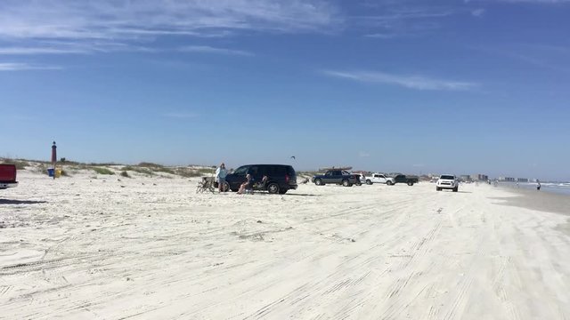 Cars along city beach. Daytona Beach has a famous road on the sand.
