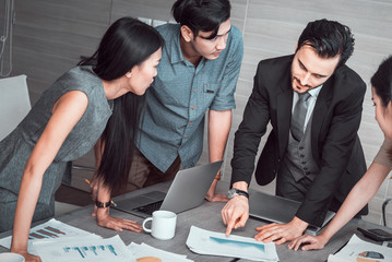 manager discussing work with his colleagues at meeting, business teamwork concept