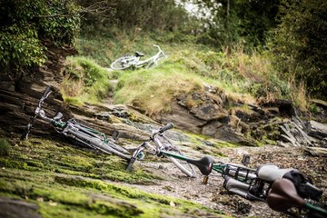 Abandoned bikes on a green trail