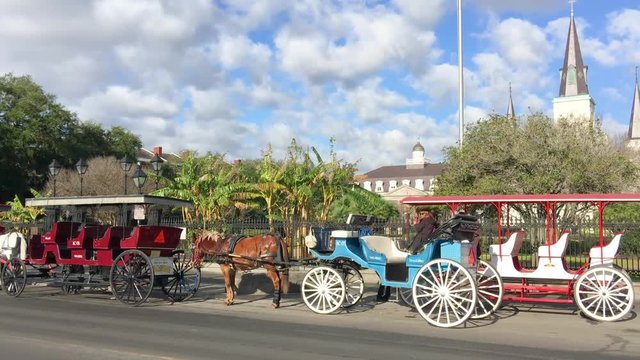 Horse Carriage along Jackson Square. New Orleans attracts 15 million tourists annually.