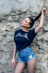 Brunette girl is vaping outdoor summer lifestyle