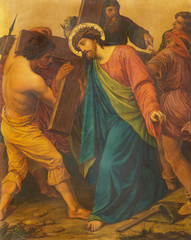 LONDON, GREAT BRITAIN - SEPTEMBER 17, 2017: The painting Jesus is helped by Simon of Cyrene to carry his cross in church of St. James Spanish Place by M. Jacob (1873).
