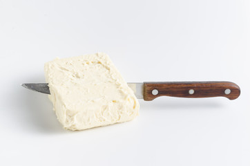 Knife in oil on a white background