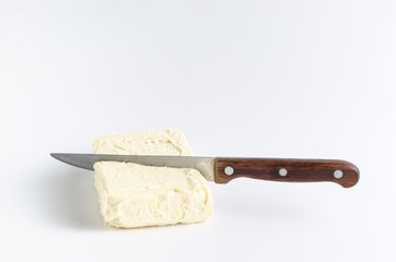 Knife in oil on a white background