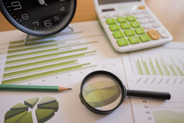 Photo diagrams graphs and numerals in the table on the paper