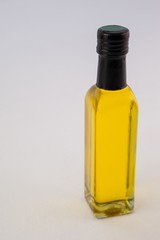 High angle view yellow oil bottle against wall