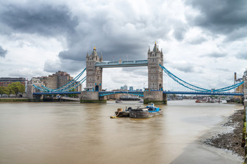 Fototapeta na wymiar LONDON - SEPTEMBER 25, 2016: Beautiful view of Tower Bridge along Thames river. London attracts 30 million tourists annually