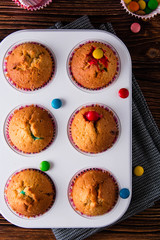 Homemade muffins colored candy.