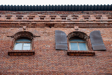 Arched windows in a brick wall