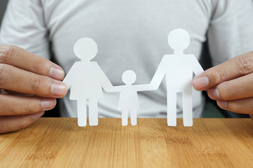 Fototapeta na wymiar Man hands holding white paper family