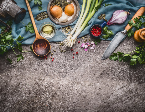 Cooking spoon with knife and cooking ingredients,  food background, top view, border