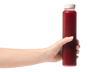 Berry fruit drink in a bottle of a female hand