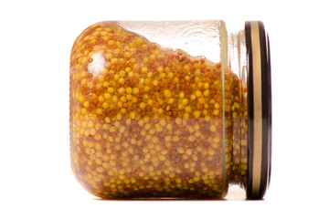 A mustard jar with grains