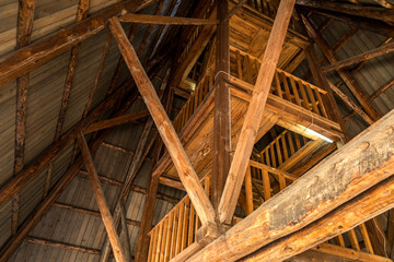 Fototapeta na wymiar Old wooden staircase in a wooden tower