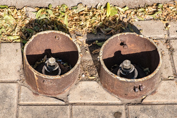 Pipes sticking out of the sidewalk