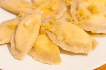 Dumplings with onion, quark and potato knows in Poland as Russian dumplings (Polish: Pierogi ruskie).