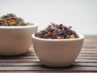 Tea of different kinds is poured into light cups.