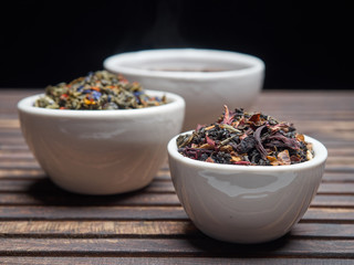 Tea of different kinds is poured into light cups.