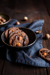 Chocolate chia seeds cookies topped with dried dates and macadamia nuts