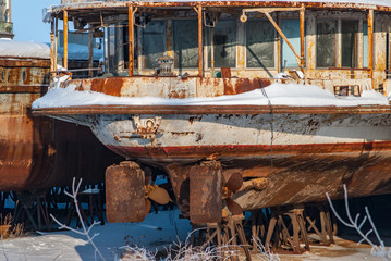 Rusty abandoned river ships