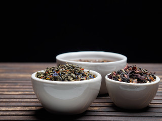 Tea of different kinds is poured into light cups.