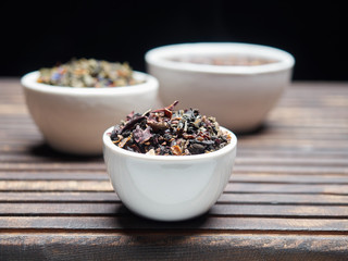 Tea of different kinds is poured into light cups.