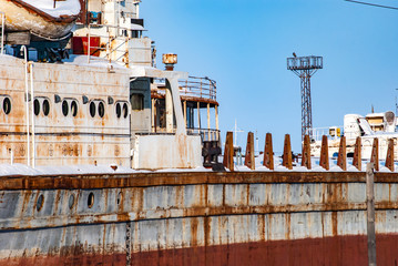 Rusty abandoned river ships