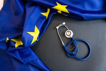 Cost of health care concept, stethoscope and calculator on document and eu flag - obrazy, fototapety, plakaty