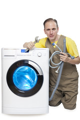 The repairman near the washing machine