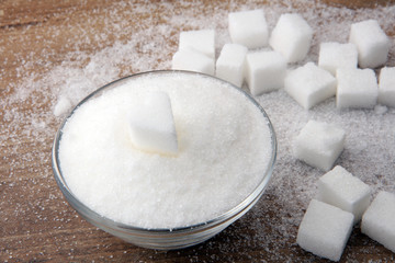 Various types of sugar, white sugar on wooden table.