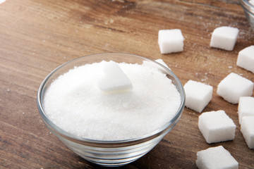 Various types of sugar, white sugar on wooden table.