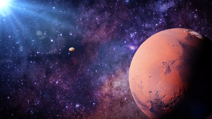 planet Mars with it moons Phobos and Deimos lit by the Sun  © dottedyeti