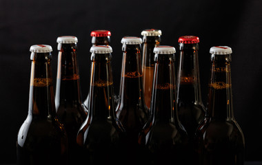 Set of beer bottles on black background