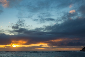Beautiful susnet over ocean water at tropical beach