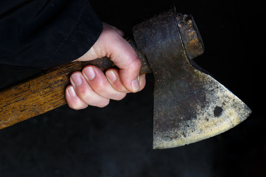 Holding An Ax In Hand