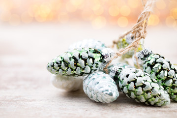 Christmas cone with red berries on a bokeh background.