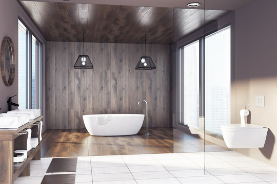 Wooden bathroom, tub, sink and toilet