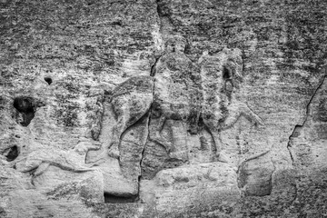 Madara Rider - an archaeological monument of the early Middle Ages (the end of the 7th century), a relief image of a rider carved on a steep rock. Bulgaria. Black and white.