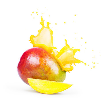 Mango with a splash of mango juice isolated on white background