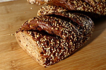freshly baked multigrain bread on rustic background, top view