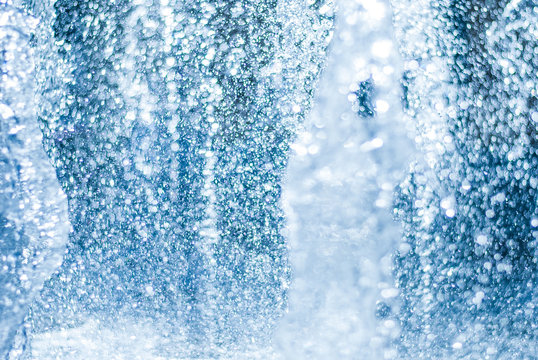 The gush of water of a fountain. Splash of water in the fountain, abstract image © simikov