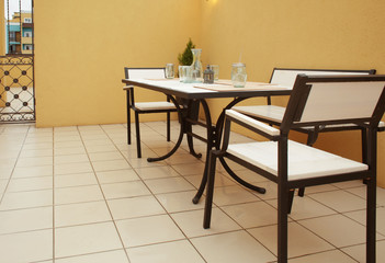 Table and chairs on roof terrace
