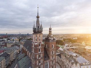 Aerial view on the main market square in Krakow and Marys Basilica. Sunset time in Poland.