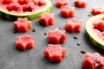 Stars made of watermelon on gray table