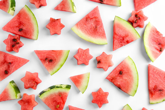 Composition with slices of ripe watermelon on white background