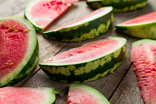 Slices of ripe watermelon on wooden  table