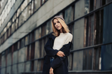 Beautiful young woman posing outdoors